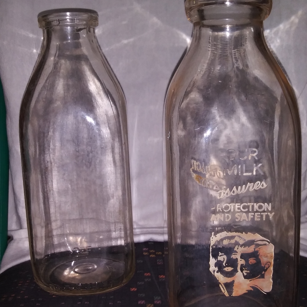 2 vintage one quart milk bottles